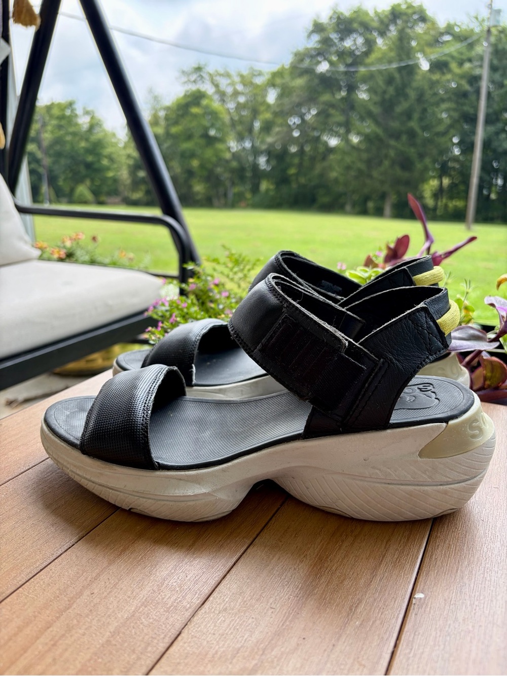 Sorel Black and Cream Platform Sandal with Yellow Pull Tab
